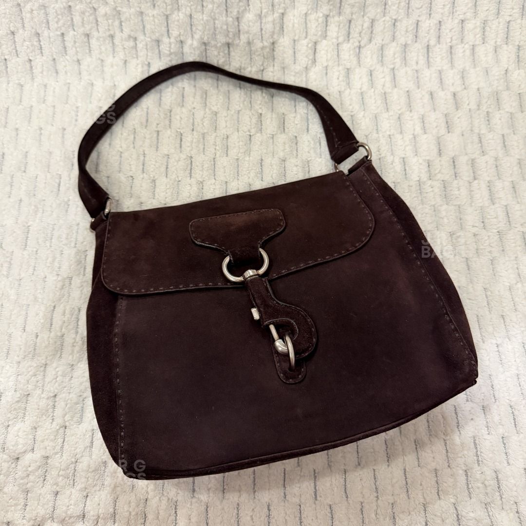 Vintage Prada Suede Shoulder Bag Brown (Category: Luxury Bags & Wallets) located in Paranaque City. Submitted by juliasmomsy (Listing ID 1470998116, Image 3). Description: Selling my pre-loved bags! :) - Authentic Vintage Prada Suede shoulder bag - SIZE: L:29 cm, H: 24 cm, W: 12 cm, Handle drop: 22 cm - COLOR: Classic dark brown - HARDWARE: Silver-tone hardware with secure clasp closure. With a triangle Prada logo on the side. - MATERIAL: Suede. 