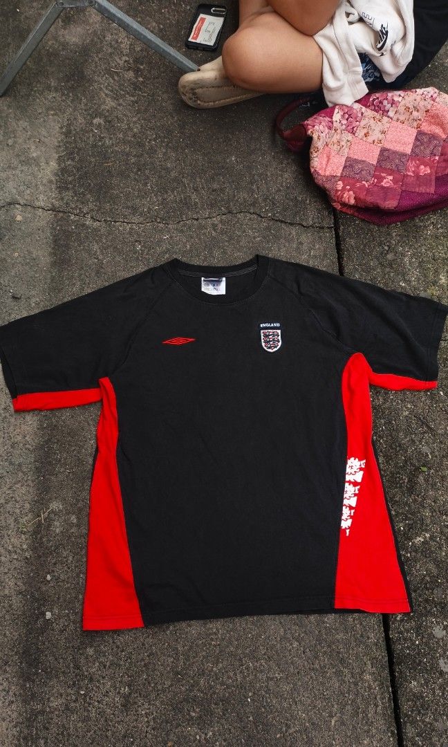 Vintage Umbro England (Category: Activewear) located in Canlaon. Submitted by thriftytrift (Listing ID 1471044994, Image 1). Description: ✔️ Official Umbro product (woven tag inside) ✔️ Embroidered red Umbro logo on the chest ✔️ England Three Lions crest patch ✔️ Red side panels and sleeve cuffs, white lions print on the side ✔️ Raglan sleeves, ribbed collar Dimes:23/28.