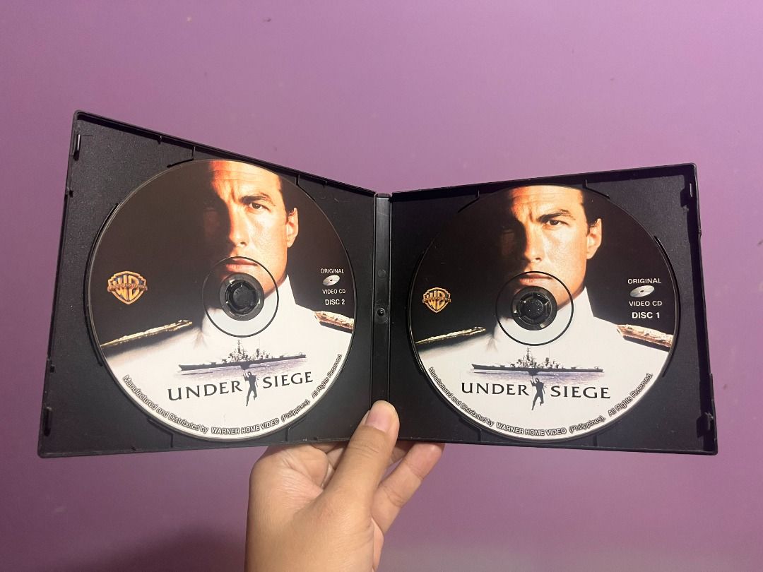 [VINTAGE VCD] Under Siege Starring Steven Seagal (Complete 2-Disc Set) (Category: CDs & DVDs) located in Dasmarinas. Submitted by eloise.sharpe (Listing ID 1471003292, Image 2). Description: Up for grabs is an original preloved Video CD (VCD) release of the classic 1992 action blockbuster "Under Siege" starring Steven Seagal and Tommy Lee Jones! Complete set including Disc 1 and Disc 2 in the original double clamshell case (Avid phil / Warner Hom