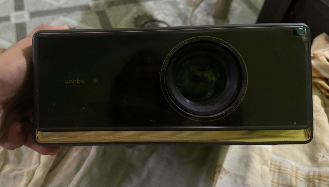 Wanbo X5 Pro Smart Projector Full HD 1080p (Category: Projectors) located in San Jose del Monte. Submitted by denielargelo (Listing ID 1471021371, Image 1). Description: - Model: Wanbo X5 Pro Smart Projector (Dark Grey) - Resolution: Native 1080p Full HD with HDR10 support - Brightness: 1100 ANSI lumens for bright, clear viewing - Smart Features: ASA 3.0 auto focus and auto keystone correction - Connectivity: Built-in Wi-Fi and Bluetooth - Ports: