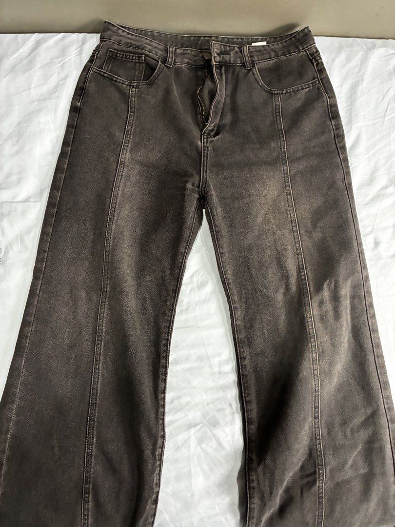Washed Flared Denim Jeans With Front Seams (Category: Jeans) located in Manila. Submitted by nikkoour (Listing ID 1470934502, Image 1). Description: - Color/Wash: Dark brown with vintage faded wash - Fit: Straight leg, mid to high rise - Details: Front vertical seam on each leg, standard belt loops, button closure, zip fly - Pockets: Two back patch pockets - Style: Great neutral piece for casual everyday outfits.