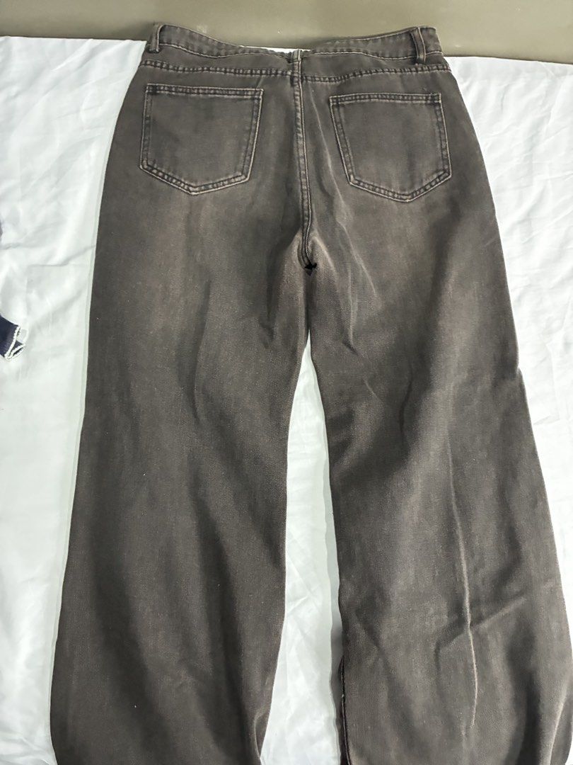 Washed Flared Denim Jeans With Front Seams (Category: Jeans) located in Manila. Submitted by nikkoour (Listing ID 1470934502, Image 2). Description: - Color/Wash: Dark brown with vintage faded wash - Fit: Straight leg, mid to high rise - Details: Front vertical seam on each leg, standard belt loops, button closure, zip fly - Pockets: Two back patch pockets - Style: Great neutral piece for casual everyday outfits.
