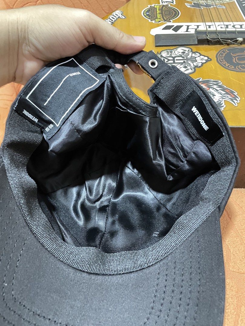 We11done Black Baseball Cap with Logo Patch (Category: Caps & Hats) located in Manila. Submitted by clementdav22513 (Listing ID 1471025682, Image 2). Description: - Brand: We11done - Color: Classic Black - Material: Clean, durable cotton with a smooth satin lining - Details: Rubberized logo patch on front, interior name tag patch, and adjustable metal buckle stamped with the brand name - Condition: Great everyday hat, excellent quality - Shipping