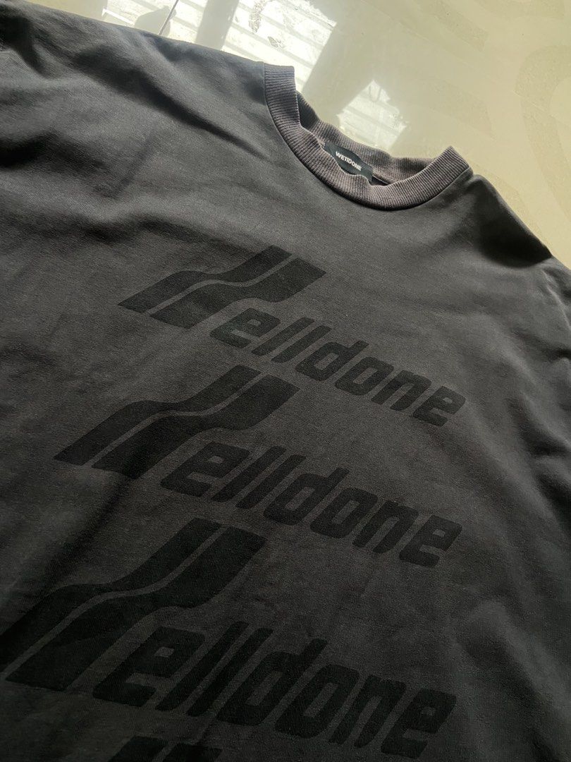 We11done Dark Grey Repeat Logo T-Shirt Size S (Category: Tshirts & Polo Shirts ) located in Manila. Submitted by noblehorse_f6bbe8 (Listing ID 1471062547, Image 3). Description: - Brand: We11done - Color: Washed Dark Grey - Size: S (Relaxed, oversized fit) - Material: Premium heavy cotton jersey - Details: Stacked brand text print on chest, ribbed crewneck, woven brand label on lower back hem - Condition: 100% authentic, well-maintained - Shippin
