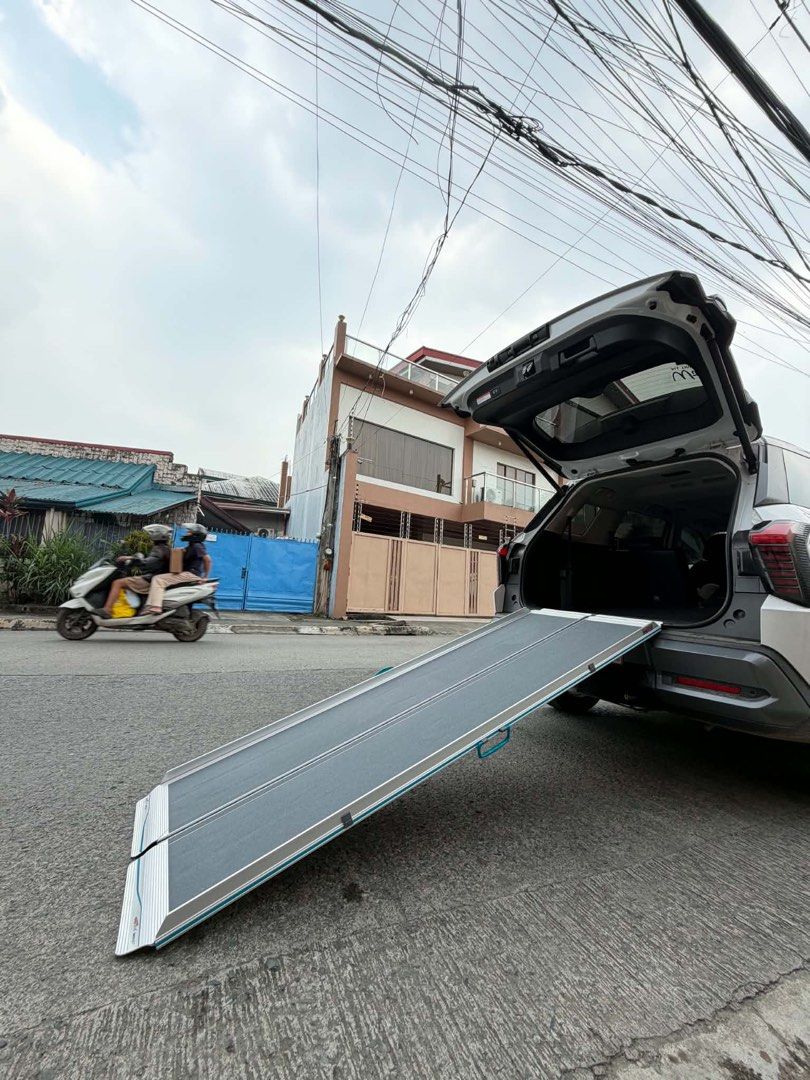 Wheelchair scooter ramp (Category: Construction & Building Materials) located in Manila. Submitted by calmdolphin.87b0e4 (Listing ID 1470959496, Image 2). Description: 🦽 Foldable Wheelchair Ramp — Description ✅ Product Details: • Material: Lightweight but heavy-duty aluminum frame ✨ • Design: Foldable / split-type — naghahati sa dalawa para madaling bitbitin at itago • Surface: Non-slip textured surface — ligtas at hindi madulas kahit basa 🛡️ •