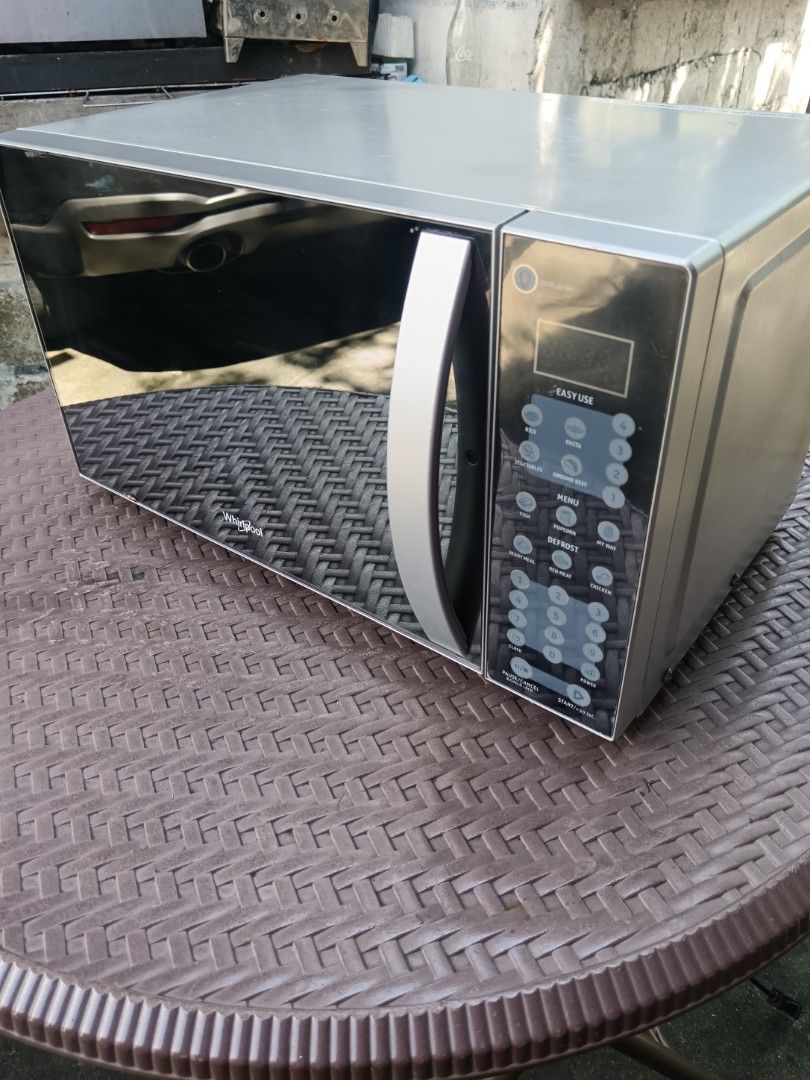 Whirlpool Microwave Oven with Digital Touch Panel (Category: Ovens & Toasters) located in Pasig City. Submitted by richs.lusr (Listing ID 1470945412, Image 1). Description: - Brand: Whirlpool Microwave Oven - Color: Sleek silver and black finish - Controls: Digital panel with presets for rice, pasta, vegetables, fish, popcorn, and meats - Features: Built-in defrost settings and convenient number pad - Interior: Clean white cavity with included gl