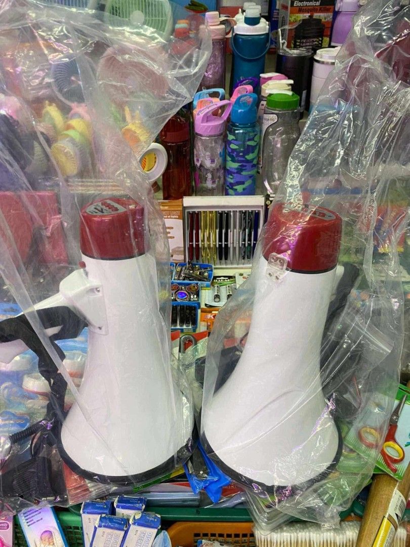 White and Red Portable Handheld Megaphone (Category: Microphones) located in Manila. Submitted by ericklee23 (Listing ID 1470995168, Image 1). Description: - Color: White and red - Quantity: 2 units available - Condition: Brand new, kept clean inside protective plastic bags - Features: Built-in handle, attached strap, and powerful loud speaker function - Best for: Events, sports games, and outdoor announcements - Pickup: Ready for quick pickup.