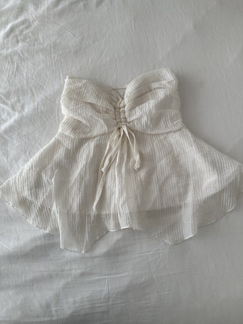 white bustier tube top with front tie (Category: Sleeveless) located in Quezon City. Submitted by 49diam (Listing ID 1470955149, Image 1). Description: sf shouldered by buyer.
