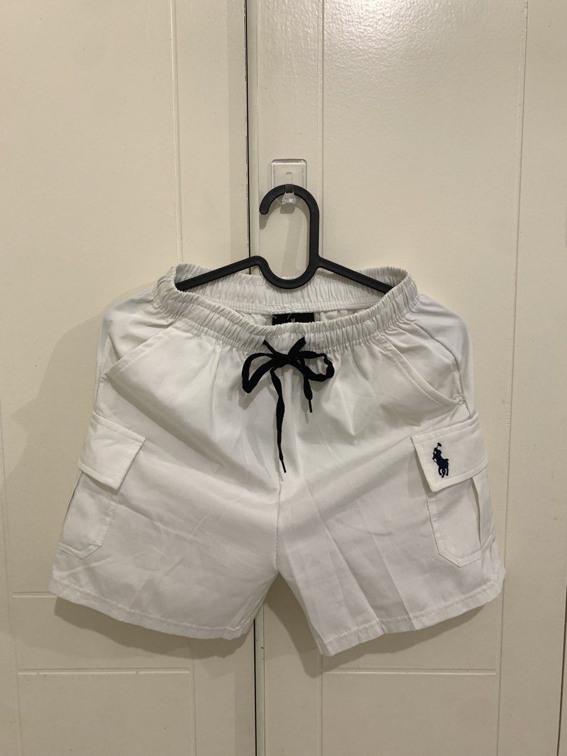 White Cargo Shorts with Black Drawstring Size M (Category: Shorts) located in Pasig City. Submitted by lovedbyri (Listing ID 1471009609, Image 1). Description: - Brand: Polo Ralph Lauren - Condition: Brand new, never worn, clean fabric - Size: M - Color: White with black drawstring waistband - Features: Side pockets and embroidered horse logo on left leg pocket - Style: Casual, perfect for hot weather.