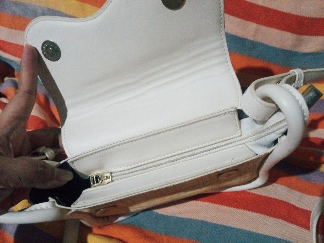 White crossbody bag with plaid front flap and strap (Category: Cross-body Bags) located in Manila. Submitted by littlelove25 (Listing ID 1471096528, Image 3). Description: - Color & Design: Elegant white crossbody bag with a stylish yellow plaid fabric accent - Closure: Secure magnetic snap under the front flap plus a main compartment zipper - Interior: Fully lined to protect your daily essentials - Strap: Comfortable and fully adjustable white s