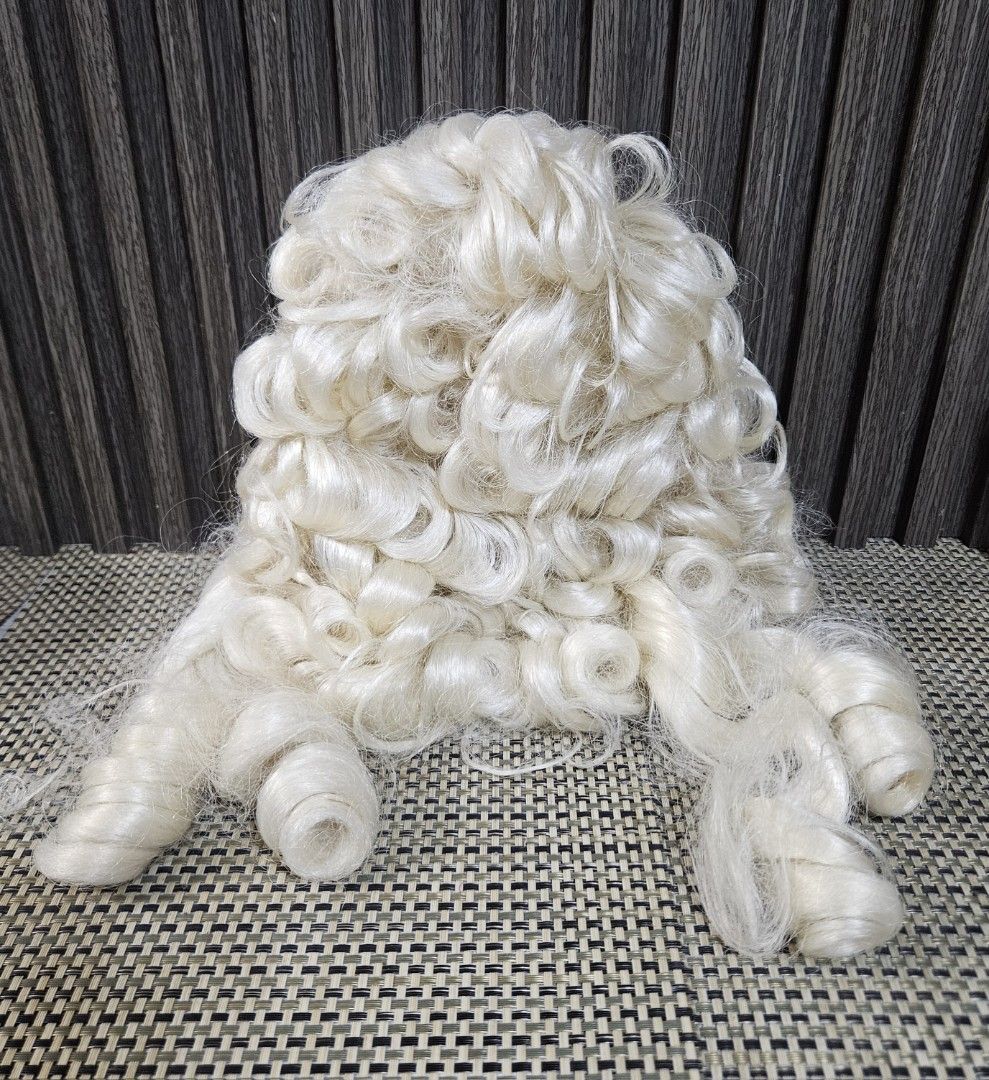 White Curly Wig Historical Costume Wig (Category: Hair Accessories) located in Rizal. Submitted by cherry_garcia (Listing ID 1471011415, Image 3). Description: White curly wig, very voluminous style with long ringlets on the sides. Interior mesh cap construction with adjustable straps. Standard adult sizing. Synthetic hair fibers. Great for cosplay, theater productions, or historical costumes. Clean interior, ready to wear..
