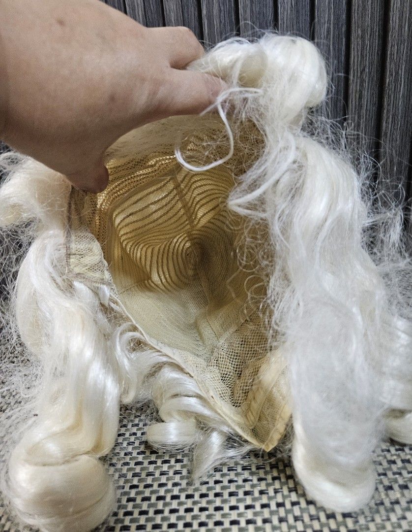 White Curly Wig Historical Costume Wig (Category: Hair Accessories) located in Rizal. Submitted by cherry_garcia (Listing ID 1471011415, Image 2). Description: White curly wig, very voluminous style with long ringlets on the sides. Interior mesh cap construction with adjustable straps. Standard adult sizing. Synthetic hair fibers. Great for cosplay, theater productions, or historical costumes. Clean interior, ready to wear..