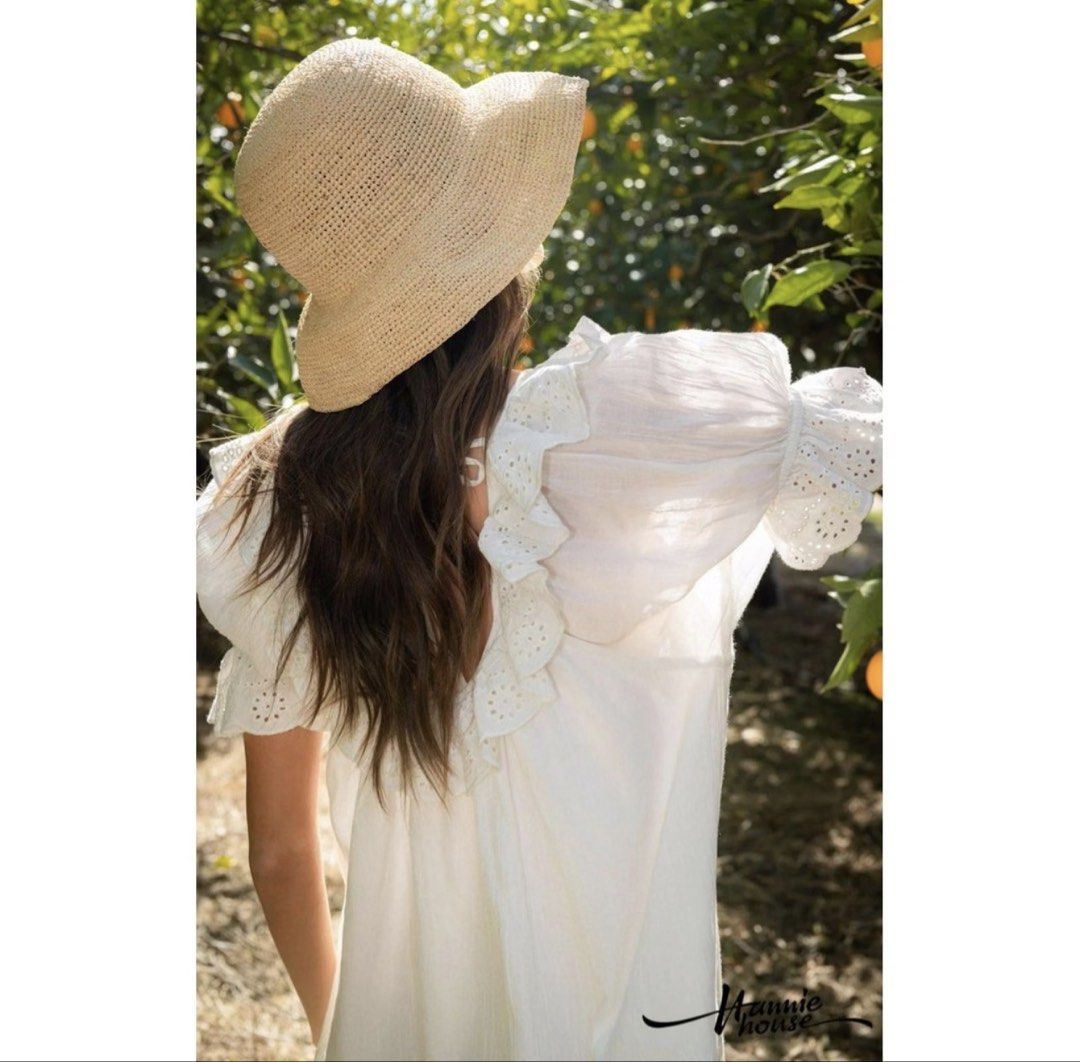 White off-shoulder ruffled eyelet blouse top (Category: Blouses) located in Paranaque City. Submitted by closetcore (Listing ID 1471019183, Image 2). Description: - Color: White - Style: Off-shoulder, relaxed fit - Details: Ruffled eyelet collar and cuffs, tie-string neckline - Sleeves: Three-quarter length - Fabric: Lightweight, textured material - Versatility: Easy to pair with jeans or shorts for casual days.