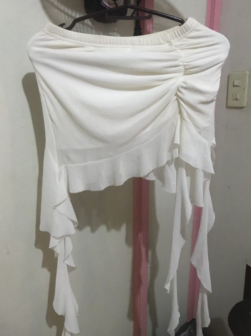 White Ruched Asymmetrical Mini Skirt with Ruffles (Category: Skirts) located in Manila. Submitted by kazoolove (Listing ID 1471030953, Image 1). Description: - from shein - w/ some small unnoticeables stains - Style: Mini skirt with front ruching and asymmetrical layered ruffles - Waistband: Elastic for an easy and comfortable fit - Fabric: Soft and lightweight - Perfect for: Casual day outs, dates, or beach trips.
