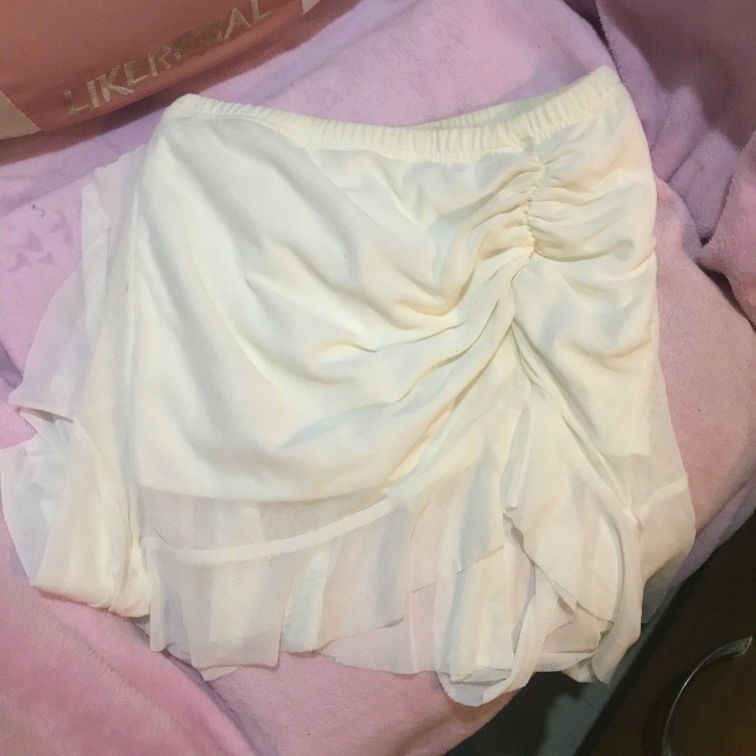 White Ruched Asymmetrical Mini Skirt with Ruffles (Category: Skirts) located in Manila. Submitted by kazoolove (Listing ID 1471030953, Image 2). Description: - from shein - w/ some small unnoticeables stains - Style: Mini skirt with front ruching and asymmetrical layered ruffles - Waistband: Elastic for an easy and comfortable fit - Fabric: Soft and lightweight - Perfect for: Casual day outs, dates, or beach trips.