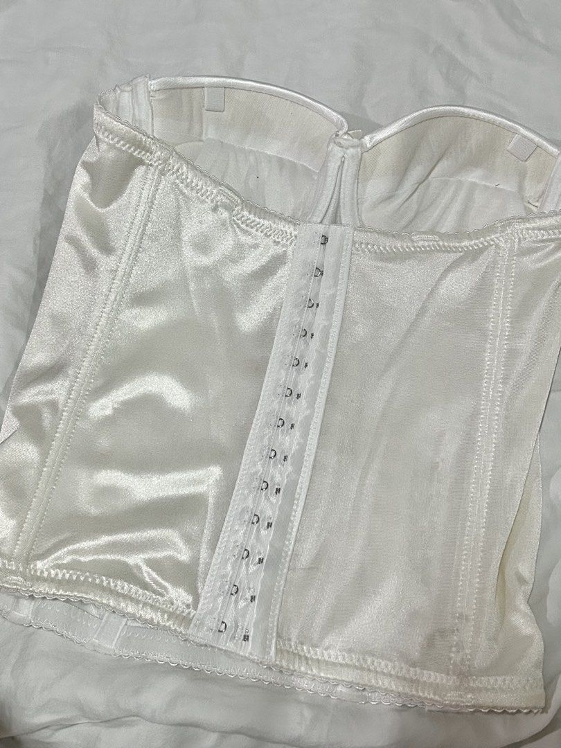 White Bustier Corset (Category: Sleeveless) located in Muntinlupa City. Submitted by _gudstuff (Listing ID 1471058538, Image 2). Description: - Color: White - Fabric: Soft and shiny satin - Style: Strapless bustier corset - Cup size: 75c on tag (34c).