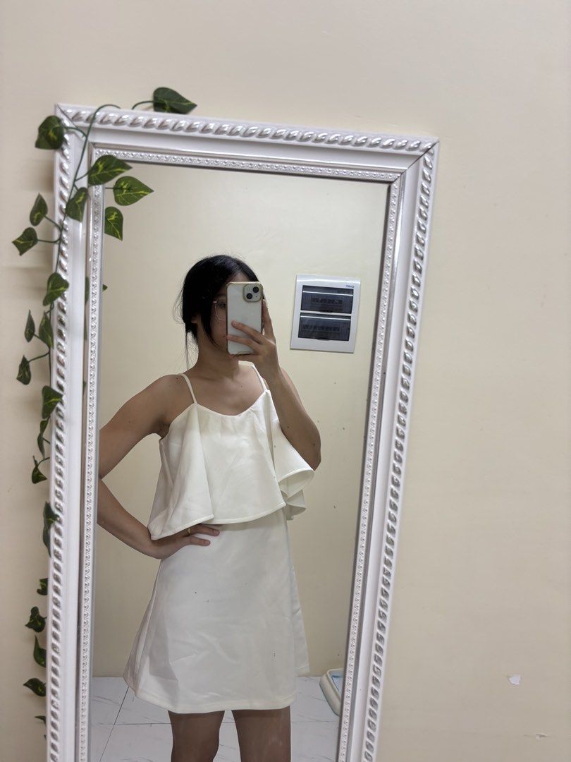 White spaghetti strap ruffle dress (Category: Dresses) located in Manila. Submitted by vegajhasse57128 (Listing ID 1471038205, Image 1). Description: - Color: Clean solid white - Style: Spaghetti strap mini dress with a statement chest ruffle - Fit: Straight fit, sits right above the knee - Finish: Smooth and sleek - Occasion: Perfect for casual outings, dates, or events - Condition: Brand new / Excellent (ready to wear!).