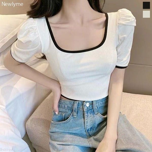 White Square Neck Puff Sleeve Crop Top (Category: Shirts) located in Bacoor. Submitted by Miss_Chuch0521 (Listing ID 1470962804, Image 2). Description: - Brand: No Brand - Style: White ribbed crop top with fitted cut - Details: Square neckline and short puff sleeves with black contrast trim - Fit: Pairs easily with high-waisted jeans - Condition: Clean, modern look ideal for casual outings.