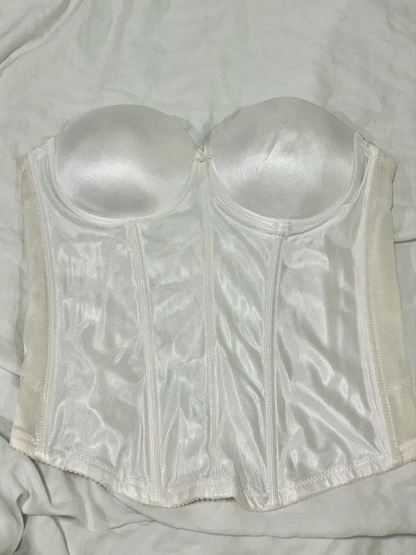 White strapless bustier corset (Category: Sleeveless) located in Muntinlupa City. Submitted by _gudstuff (Listing ID 1471059107, Image 1). Description: - Color: Classic white - Material: Smooth satin-finish fabric with clean lining - Support: Built-in underwire cups and firm internal boning for shaping - Closure: Hook-and-eye closure down the back - Cup size: 85 on tag (38b).