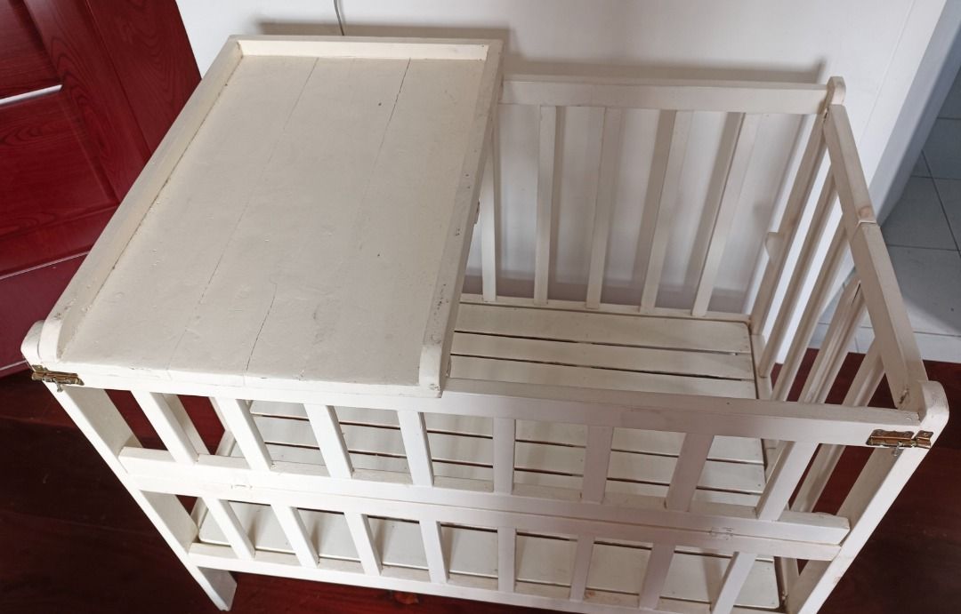 White Wooden Baby Cot with Changing Table (Category: Cots & Cribs) located in Makati City. Submitted by ayekai (Listing ID 1471089423, Image 2). Description: Custom-made adjustable crib for new born to 3yrs old with changing board Condition: Used Like New RFS: Decluttering Slightly Negotiable.