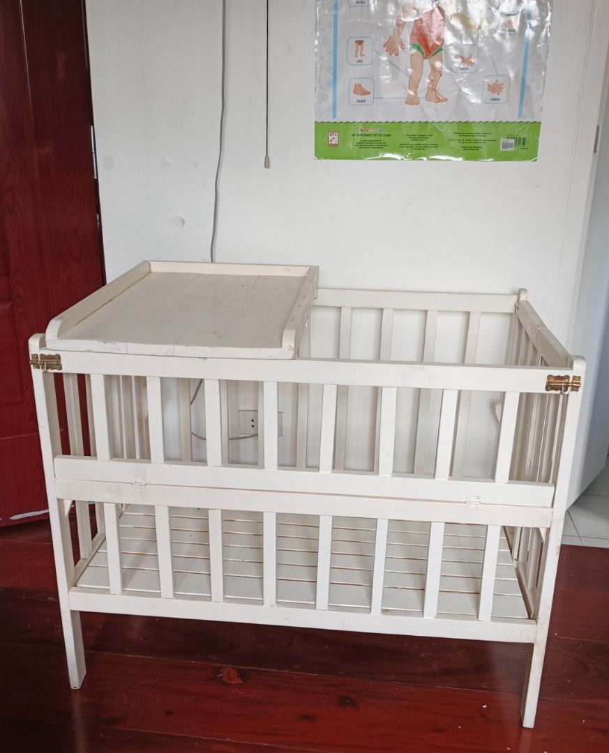 White Wooden Baby Cot with Changing Table (Category: Cots & Cribs) located in Makati City. Submitted by ayekai (Listing ID 1471089423, Image 1). Description: Custom-made adjustable crib for new born to 3yrs old with changing board Condition: Used Like New RFS: Decluttering Slightly Negotiable.