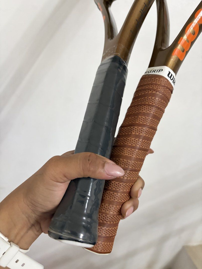 Wilson tennis racket (Category: Racket and Ball Sports) located in Taytay. Submitted by murahubblueapppage (Listing ID 1471028820, Image 3). Description: two bronze-colored Wilson Pro 97 Staff V14 tennis racquets featuring a signature metallic earth-tone finish and a round Wilson BLX-branded hangtag on the strings The other One is brand new And the other one used twice only for affiliates only With case For both.