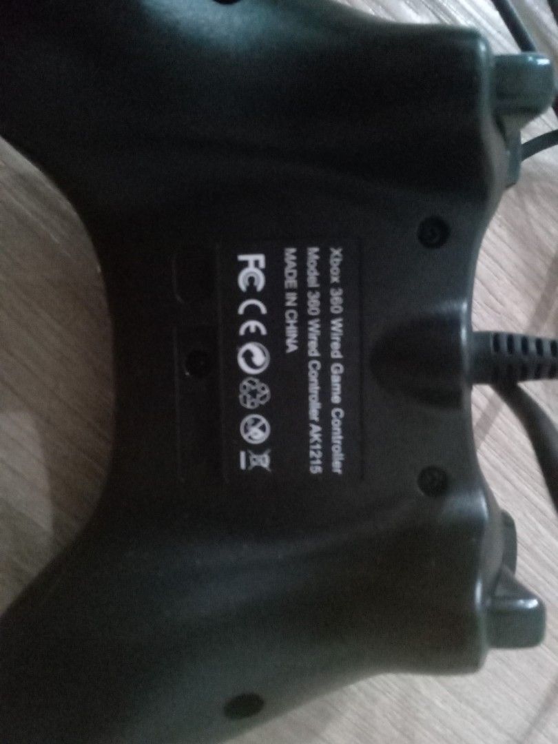 Wired Game Controller (Category: Controllers) located in Kuala Lumpur. Submitted by tiryaq (Listing ID 1471013652, Image 3). Description: - Works directly with PC and Laptop - Wired connection - Design: Standard layout featuring dual analog sticks, D-pad, and responsive action buttons - Condition: Solid grip, plug-and-play setup, with minor dust from storage CAN NEGO NO REFUND.