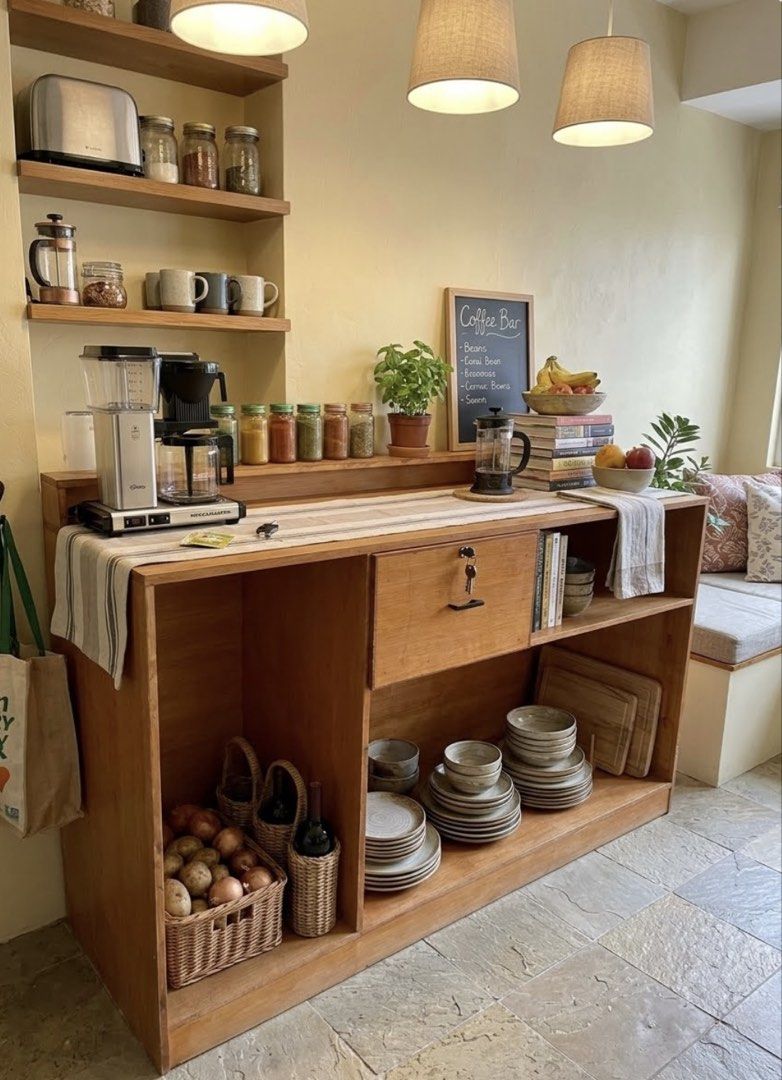 Wooden Coffee Bar Counter Console Table Kitchen Storage (Category: Tables & Sets) located in Muntinlupa City. Submitted by ahermosa (Listing ID 1470960407, Image 1). Description: - Custom wooden coffee bar and kitchen storage counter - Natural wood finish with a sturdy construction. Need re-varnished since naalibukan na at nastock sya sa garage nalang - Dimensions: 73" length x 24" depth x 44" height - Central pull-out drawer equipped with a blac
