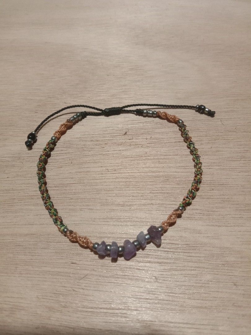 Woven Macrame Friendship anklet with Purple Crystal Chips (Category: Anklets) located in Danao, Cebu. Submitted by rennan.546 (Listing ID 1471097334, Image 1). Description: Rennan crafts anklet 📿💚💛♥️ - Style: Bohemian everyday handmade macrame bracelet - Materials: Earthy brown and multi-colored threads, silver-toned beads, and purple crystal chip stones - Closure: Adjustable sliding knot for a custom, comfortable fit on most wrists - Vibe: Li