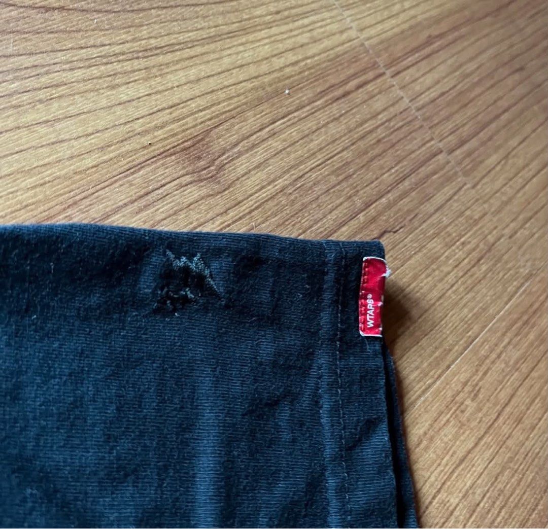 WTAPS Concrete Environment Black T-Shirt (Category: Tshirts & Polo Shirts ) located in Caloocan City. Submitted by landcruiser76__ (Listing ID 1471077156, Image 2). Description: - Brand: WTAPS - Color: Black with bold yellow 'CONCRETE ENVIRONMENT' chest graphic - Details: Small upper back print, woven front hem logo patch, and signature red sleeve tag - Fit: Regular crew neck cut - Condition: Pre-loved with normal signs of wear - Mode of Payment: