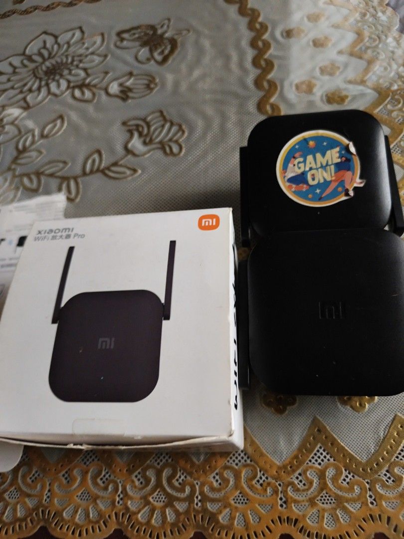 Xiaomi WiFi Repeater Pro Set (Category: Other Accessories) located in Pasig City. Submitted by virgolady88 (Listing ID 1470932855, Image 3). Description: - Set of 2 black Xiaomi WiFi Repeater Pro units for better home wireless coverage - One unit features a custom round game sticker on top - Direct wall plug-in design for easy installation - Quick and simple setup using the Mi Home app - Includes original box (with minor storage wear) and instruc