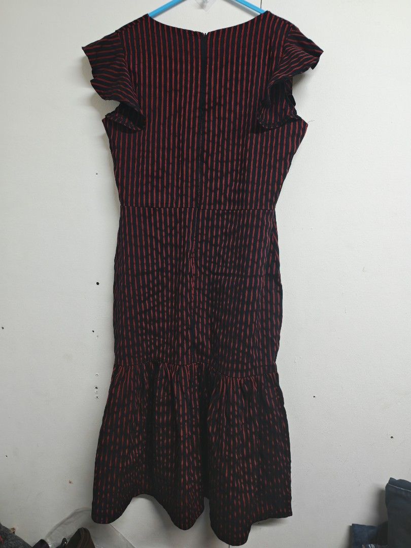 XL Meg Striped Ruffle dress (Category: Dresses) located in Pasig City. Submitted by she_declutters_ph (Listing ID 1470985252, Image 2). Description: Used 2x. Material is a bit stretchy. - Brand: Meg - Style: Midi dress with red vertical stripes - Size: XL - Details: Square neckline, short ruffle sleeves, fitted waist, and slightly flared hem - Closure: Back zipper - Fabric: Lightweight and comfortable - Occasion: Great for casual outings or dinne