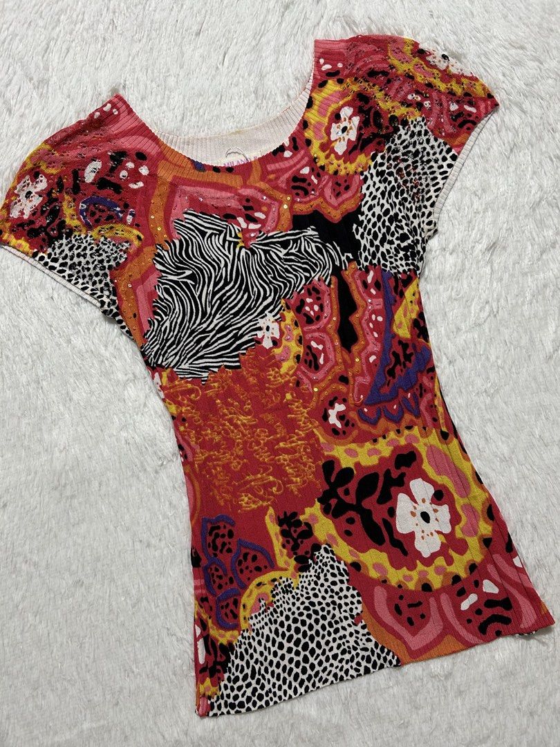 Y2k AOP short-sleeve top (Category: Others Tops) located in Quezon City. Submitted by herarchiveph (Listing ID 1470962189, Image 2). Description: Y2k MILANO II AOP short-sleeve top Width: 26 inches Length: 25 inches Minor issue: washable stain, missing few beads (barely noticeable).