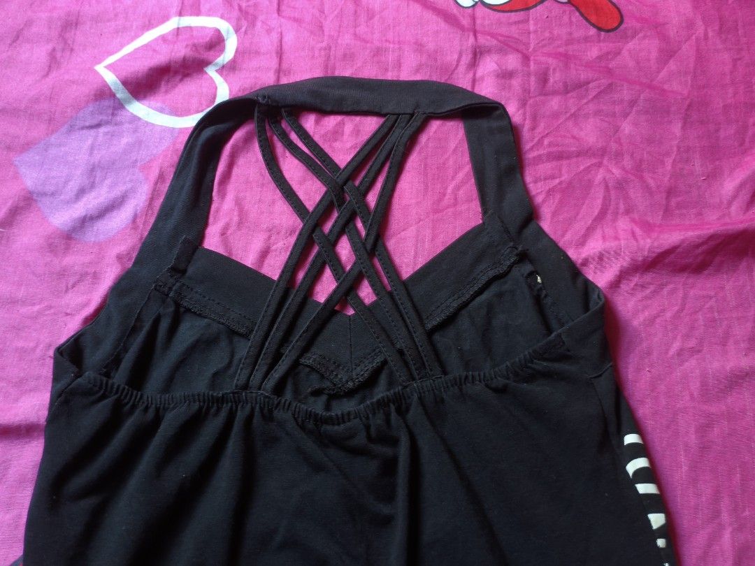 y2k crisscross halter top (Category: Others Tops) located in Manila. Submitted by avwilynn (Listing ID 1471003461, Image 3). Description: *Black Y2K Halter Tank Top - Criss-Cross Back* McBling / Y2K style tank top. *Details:* - *Color:* Black - *Design:* Halter neck with thick band. Graphic print on front - heart with wings and text "PACHE INDIA" repeated, metallic silver/gold foil print - *Back:* Sexy criss-cross strappy back, open back style. H