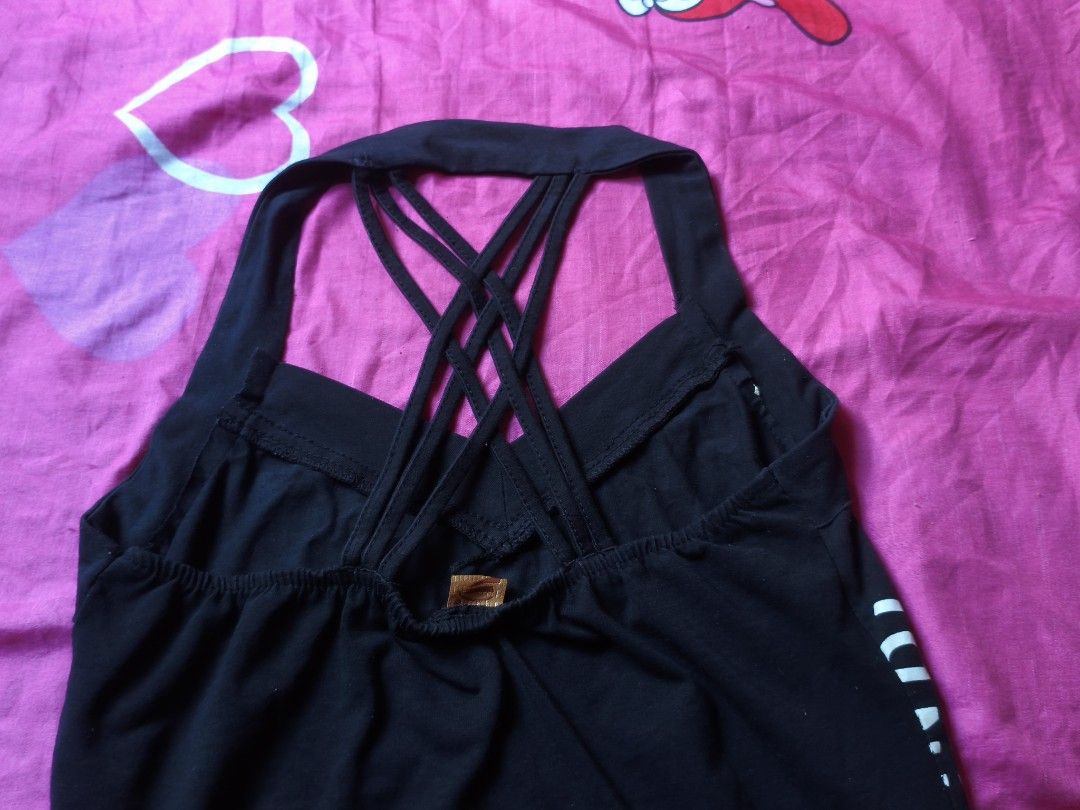y2k crisscross halter top (Category: Others Tops) located in Manila. Submitted by avwilynn (Listing ID 1471003461, Image 2). Description: *Black Y2K Halter Tank Top - Criss-Cross Back* McBling / Y2K style tank top. *Details:* - *Color:* Black - *Design:* Halter neck with thick band. Graphic print on front - heart with wings and text "PACHE INDIA" repeated, metallic silver/gold foil print - *Back:* Sexy criss-cross strappy back, open back style. H