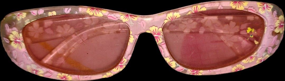 Y2K Kids sunglasses (Category: Sunglasses & Eyewear) located in Quezon City. Submitted by morningstar_52 (Listing ID 1471035275, Image 1). Description: -FOR BUYERS ONLY, 300 PESOS MINIMUM PURCHASE Style: Fun Y2K vibe accessory - Design: Pink sunglasses with all-over yellow and pink flower patterns - Lenses: Transparent pinkish-red tint - Fit: Regular fit, lightweight plastic build - Hardware: Standard temples and hinges.