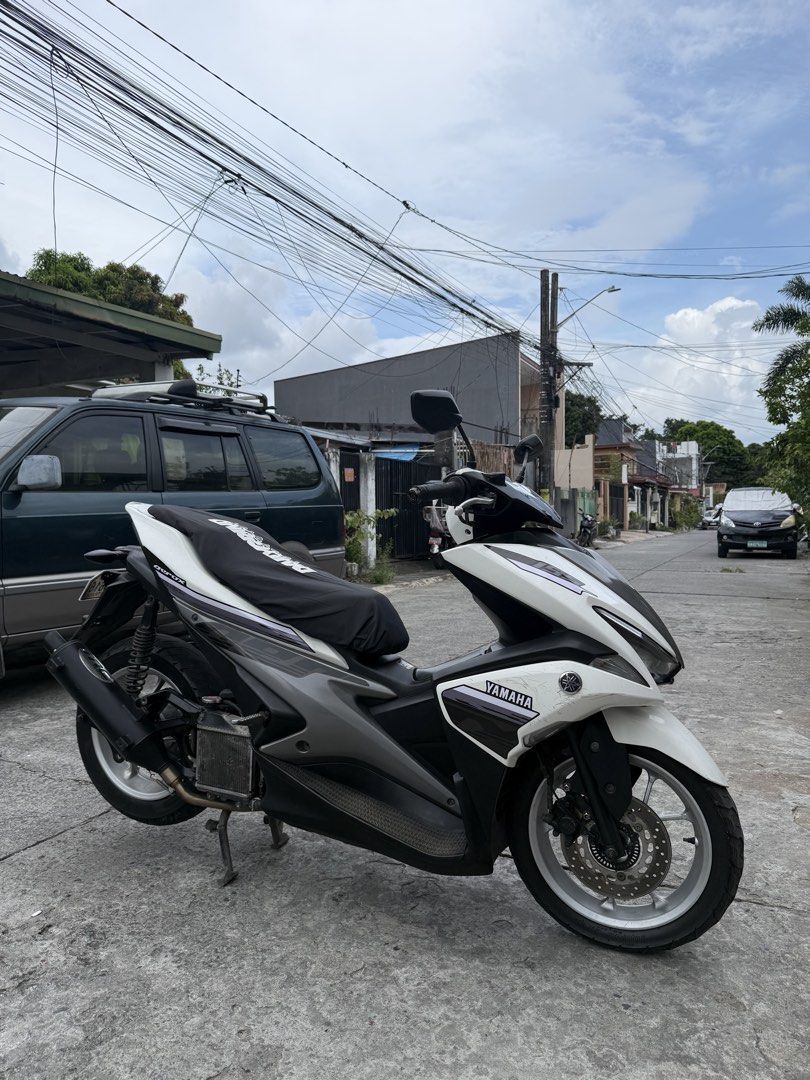 Yamaha Aerox 155 Motorcycle (Category: Motorbikes for Sale) located in Bacoor. Submitted by bernardjustine (Listing ID 1470936547, Image 2). Description: FOR SALE Yamaha Aerox S V1 2019 Model Abs keyless 31k orig odo All stock engine Complete orig OR/CR 1st owner open dos Id with 3 signatures 2 original remote keys with code Thick tires 90% front and rear No dragging No usok No tagas TRC pipe Issue: scratches, unregistered Asking price: 62,000 ne