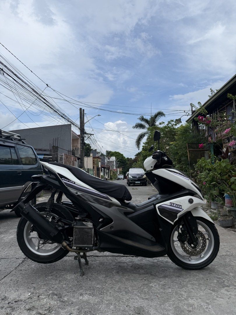 Yamaha Aerox 155 Motorcycle (Category: Motorbikes for Sale) located in Bacoor. Submitted by bernardjustine (Listing ID 1470936547, Image 1). Description: FOR SALE Yamaha Aerox S V1 2019 Model Abs keyless 31k orig odo All stock engine Complete orig OR/CR 1st owner open dos Id with 3 signatures 2 original remote keys with code Thick tires 90% front and rear No dragging No usok No tagas TRC pipe Issue: scratches, unregistered Asking price: 62,000 ne