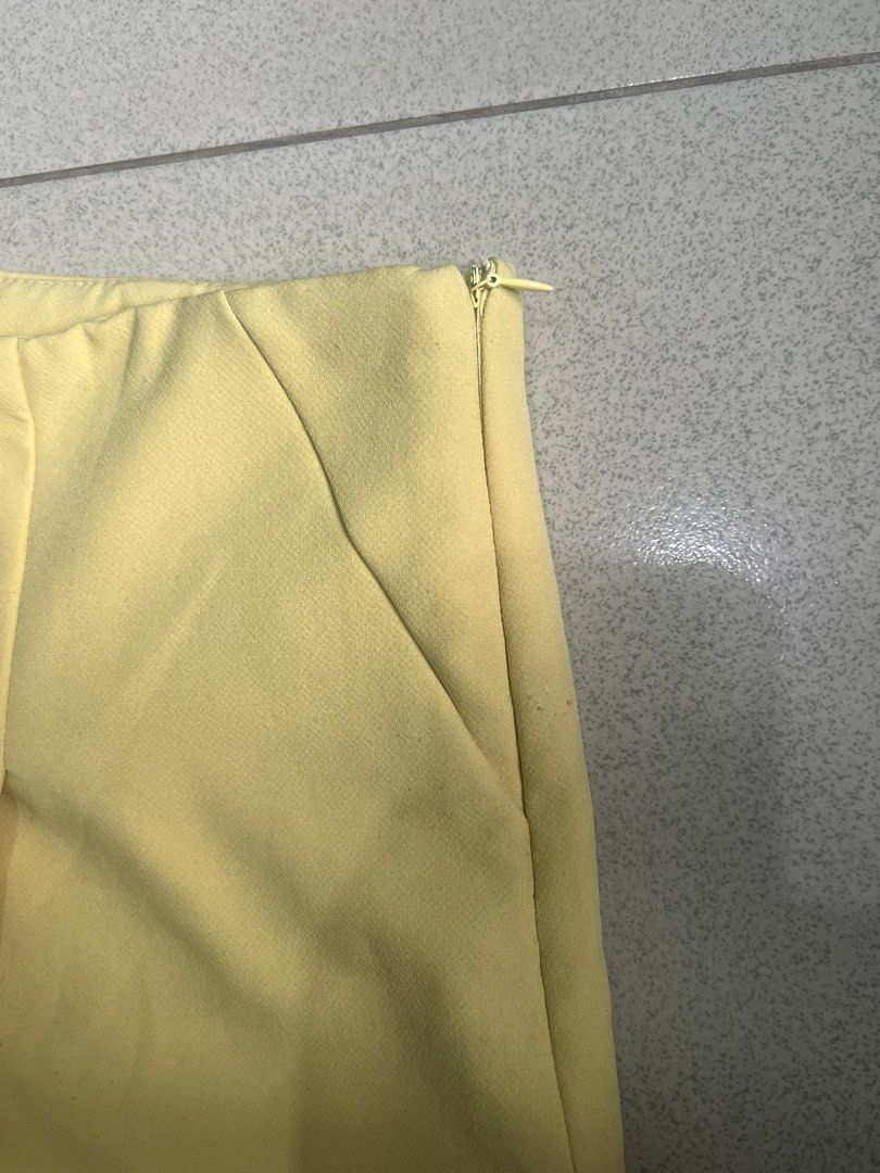 Yellow Pleated Skorts (Category: Skirts) located in Batangas. Submitted by alaisaampa7513 (Listing ID 1471028567, Image 3). Description: - Brand: Koton - Item: Bright yellow skorts (skirt look with shorts underneath) - Size: EUR 44 / D/CH 42 / UK 16 - Details: Front pleats, hidden side zipper closure - Condition: Clean fabric, no major flaws found - Perfect vibrant pop of color for sunny days!.