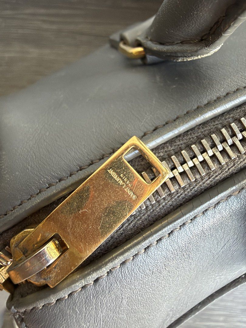 YSL DUFFLE WITH CARD GRAY (Category: Luxury Bags & Wallets) located in Makati City. Submitted by moiobsession (Listing ID 1470954962, Image 3). Description: authentic with authenticity card small size .