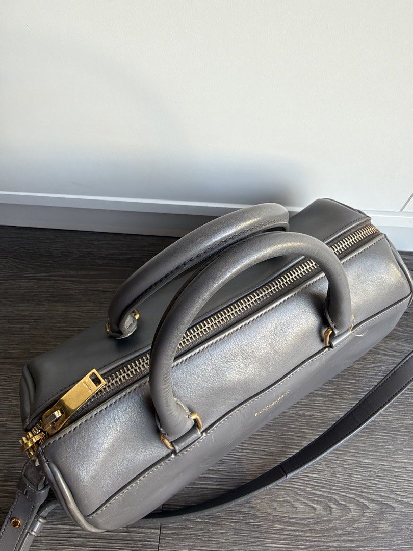YSL DUFFLE WITH CARD GRAY (Category: Luxury Bags & Wallets) located in Makati City. Submitted by moiobsession (Listing ID 1470954962, Image 2). Description: authentic with authenticity card small size .