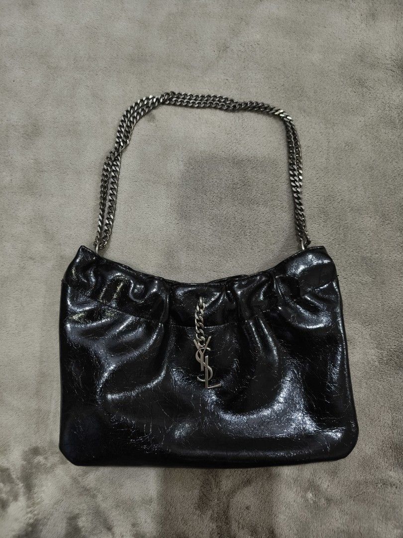 Yves saint Laurent Pac pac Ruched Hobo Leather (Category: Luxury Bags & Wallets) located in Manila. Submitted by _vann (Listing ID 1471095017, Image 1). Description: - Brand: Yves saint Laurent - Material: Black crinkled patent leather - Origin: Made in Italy - Condition: Excellent -Price still nego.