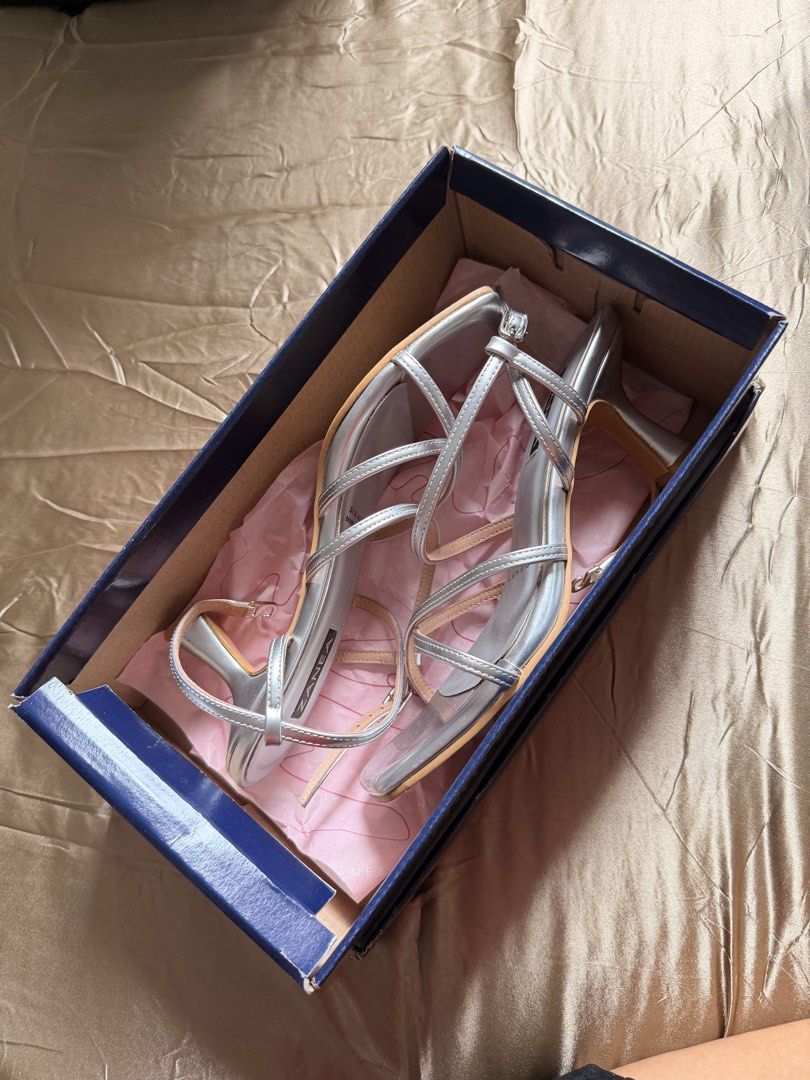 Zanea Silver Strappy Heels Size 7 (Category: Heels) located in Baguio. Submitted by nabiwuh.06 (Listing ID 1471019085, Image 3). Description: - Brand: Zanea (Made in Marikina) - Color/Material: Metallic silver - Size: 7 - Style: Slim curved heels, delicate crossover straps, square toes, adjustable ankle buckle - Used once only nung Graduation - Orig price: 1699 - Inclusions: Original SM Store box 📍Pangasinan/Baguio 🚚 JNT/LBC.