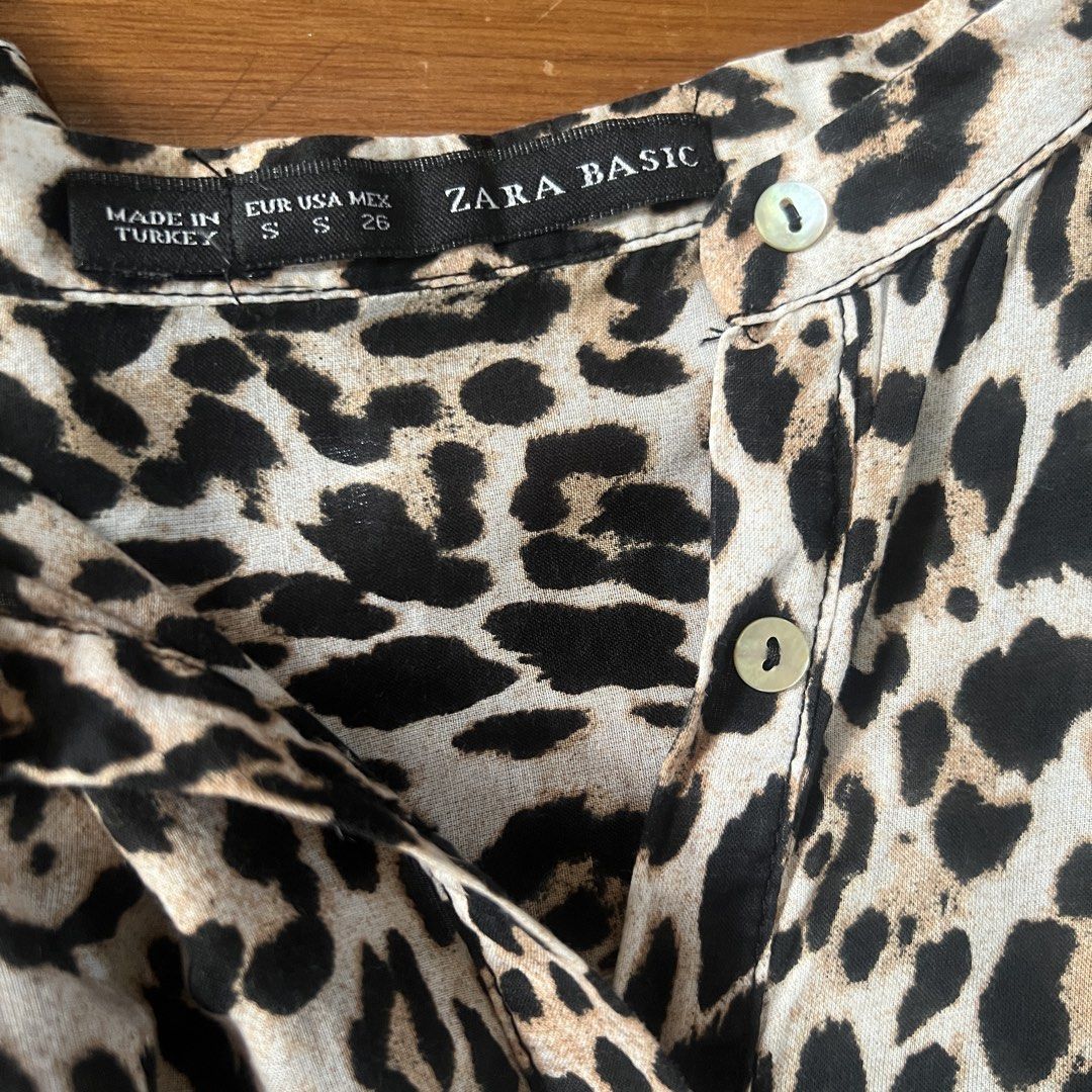 Zara basic long sleeve button top leopard print (Category: Longsleeves) located in Cebu City. Submitted by mariascart (Listing ID 1470946449, Image 2). Description: Pristine condition Very soft cloth Comfy to wear .