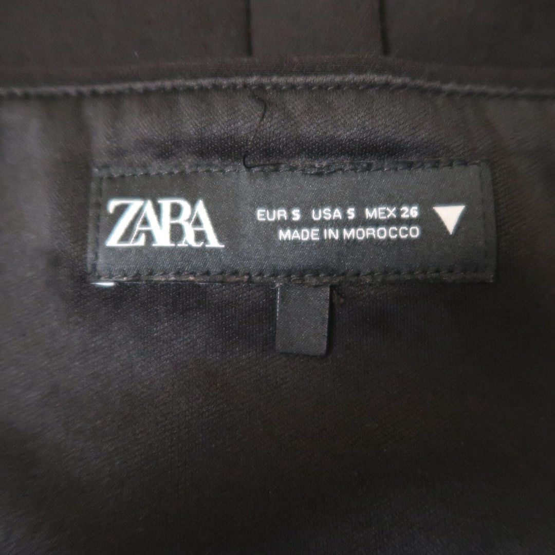 Zara Black Halter Top Size S (Category: Sleeveless) located in Manila. Submitted by mairalyng21434 (Listing ID 1471038157, Image 2). Description: - Brand: Zara - Size: S (Made in Morocco) - Color: Classic black - Design: Structured halter top with front pockets, dangling strap detail, and open upper back - Condition: Great piece, perfect for nights out and casual outings - DM for inquiries or fast checkout!.