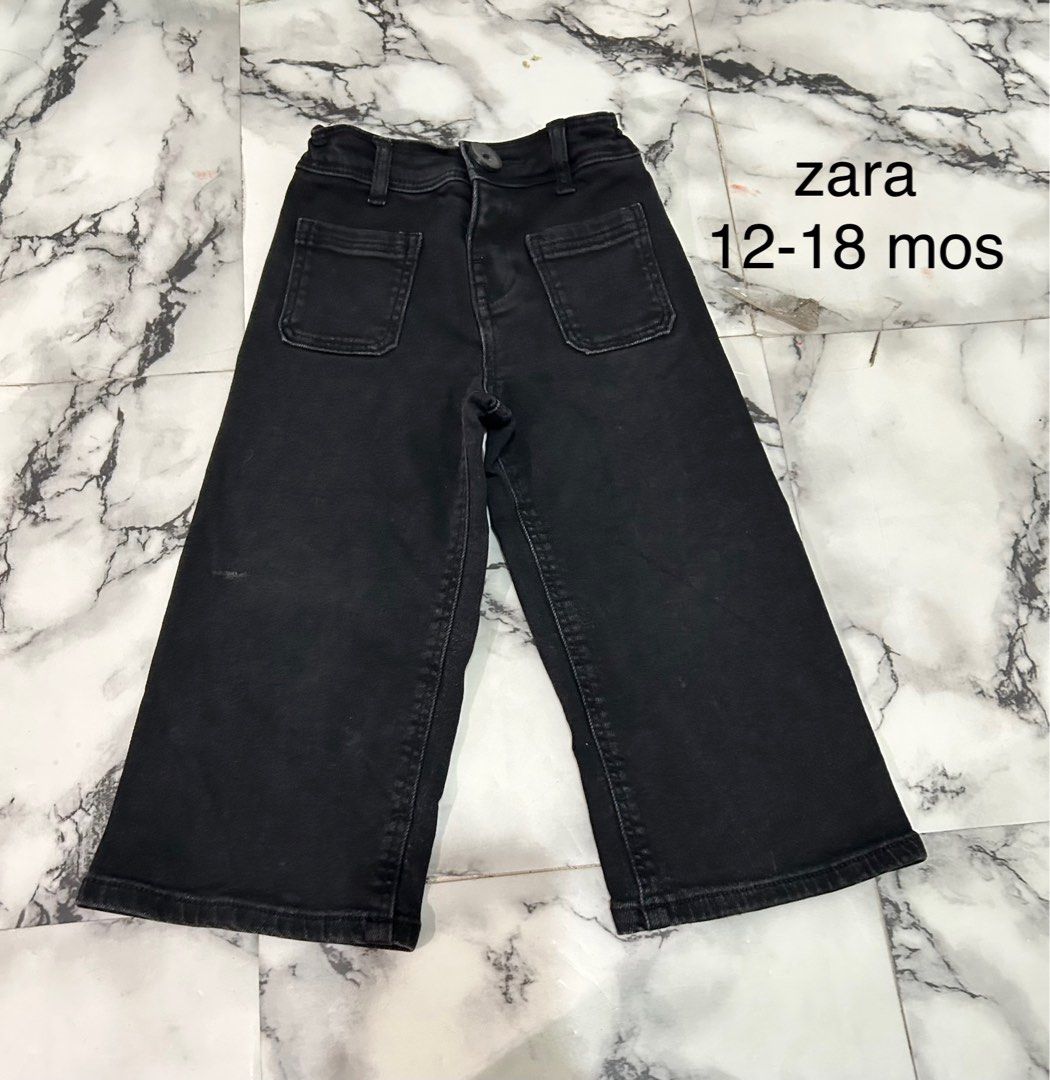 Zara Black Jeans 12-18 Months (Category: Jeans) located in Rizal. Submitted by threegoddess (Listing ID 1471083279, Image 1). Description: - Brand: Zara - Size: 12-18 months - Color: Classic Black - Style: Wide leg silhouette with front patch pockets - Details: Button closure at the waist with belt loops - Condition: Great for everyday toddler wear.