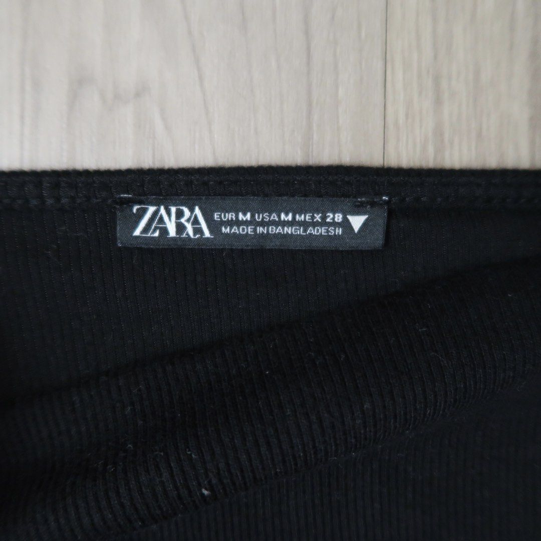 Zara Black Puff Sleeve Top Size M (Category: Blouses) located in Manila. Submitted by mixi_lexi (Listing ID 1471038502, Image 2). Description: - Brand: Zara - Size: Medium (EUR M, USA M, MEX 28) - Color: Classic Black - Material: Comfortable ribbed fabric - Design: Dramatic statement puff sleeves, square neckline, and form-fitting ruched body - Origin: Made in Bangladesh - Condition: Worn a few times, no major flaws - Styling: Versatile piece tha