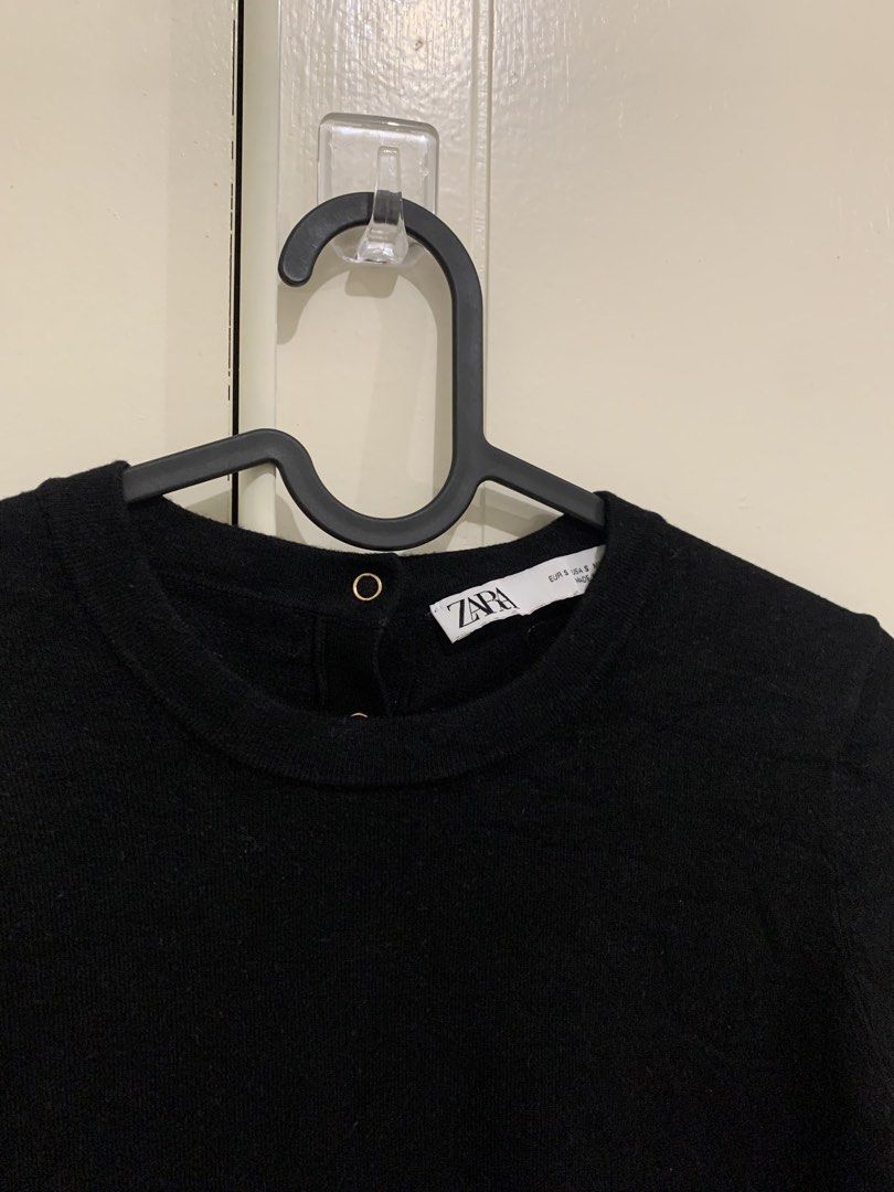 Zara Black Short Sleeve Knit Top Size S (Category: Blouses) located in Pasig City. Submitted by lovedbyri (Listing ID 1471009908, Image 2). Description: - Brand: Zara - Size: S (EUR/USA) - Color: Black - Material: Clean knit fabric - Design: Crew neck, short sleeves, ribbed hem and cuffs - Detail: Gold-tone button closures at the back neckline - Condition: Excellent, no pulls or damage - Style: Classic, versatile basic.