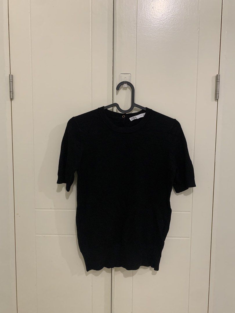 Zara Black Short Sleeve Knit Top Size S (Category: Blouses) located in Pasig City. Submitted by lovedbyri (Listing ID 1471009908, Image 1). Description: - Brand: Zara - Size: S (EUR/USA) - Color: Black - Material: Clean knit fabric - Design: Crew neck, short sleeves, ribbed hem and cuffs - Detail: Gold-tone button closures at the back neckline - Condition: Excellent, no pulls or damage - Style: Classic, versatile basic.
