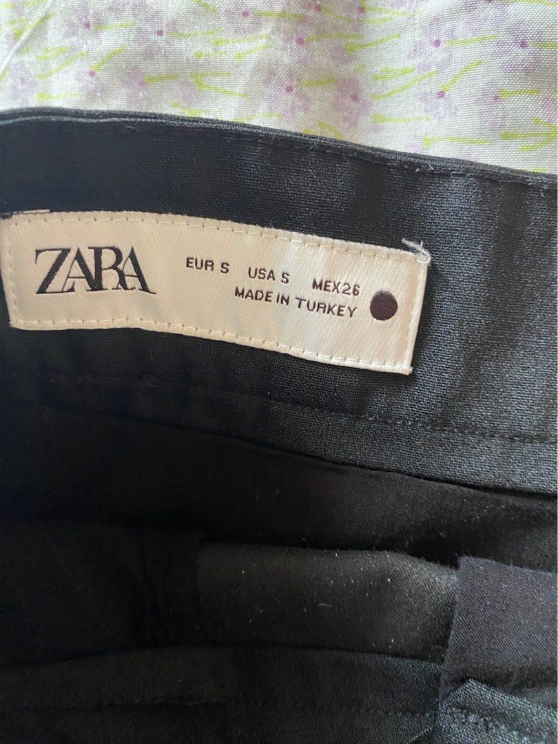 Zara Black Tailored Mini Skirt Size S (Category: Skirts) located in Quezon City. Submitted by damclothings.ph (Listing ID 1470951608, Image 3). Description: - Brand: Zara - Size: S (EUR/USA S) - Color: Solid black - Design: Classic tailored mini skirt with clean lines and belt loops - Versatility: Easy to dress up for the office or keep casual for weekends.